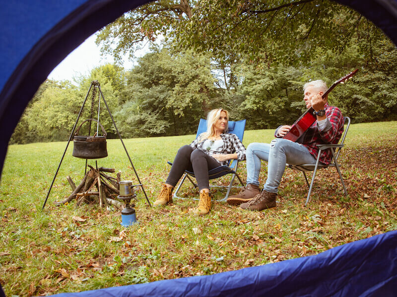 Woman struggling to hear her husband while camping.