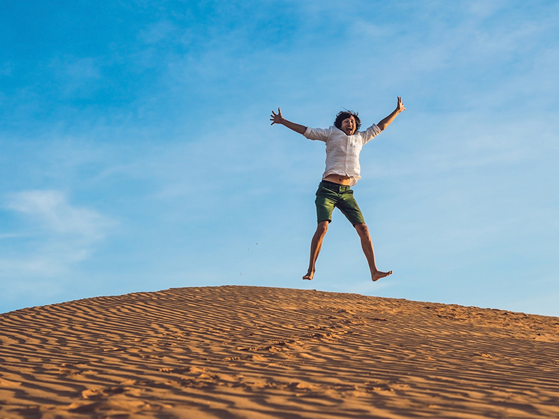 Picture of guy jumping | How Hearing Aids can Keep You Motivated?
