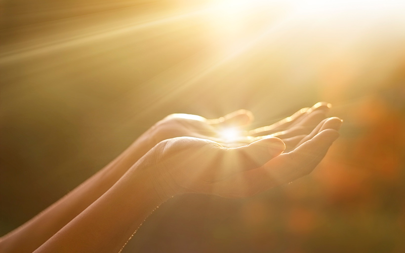 Picture of sunlight in hands.