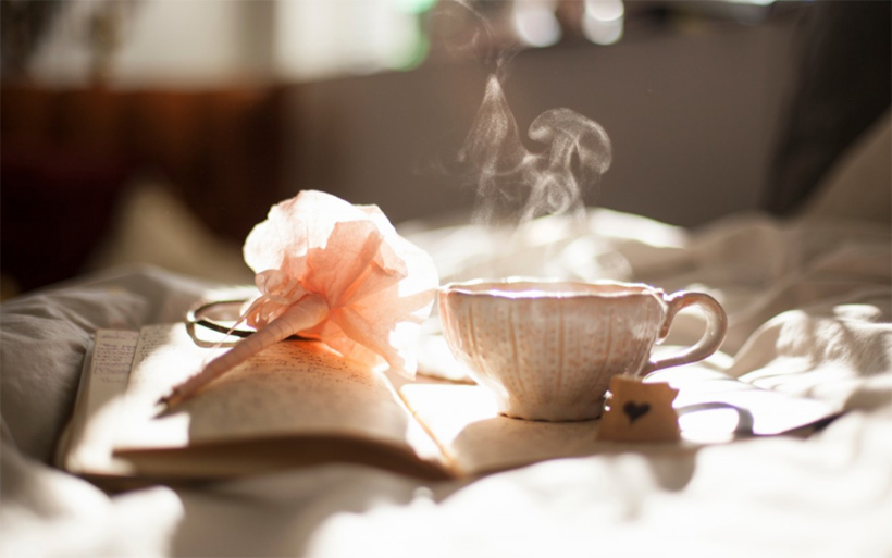 Picture of a journal and tea with a rose