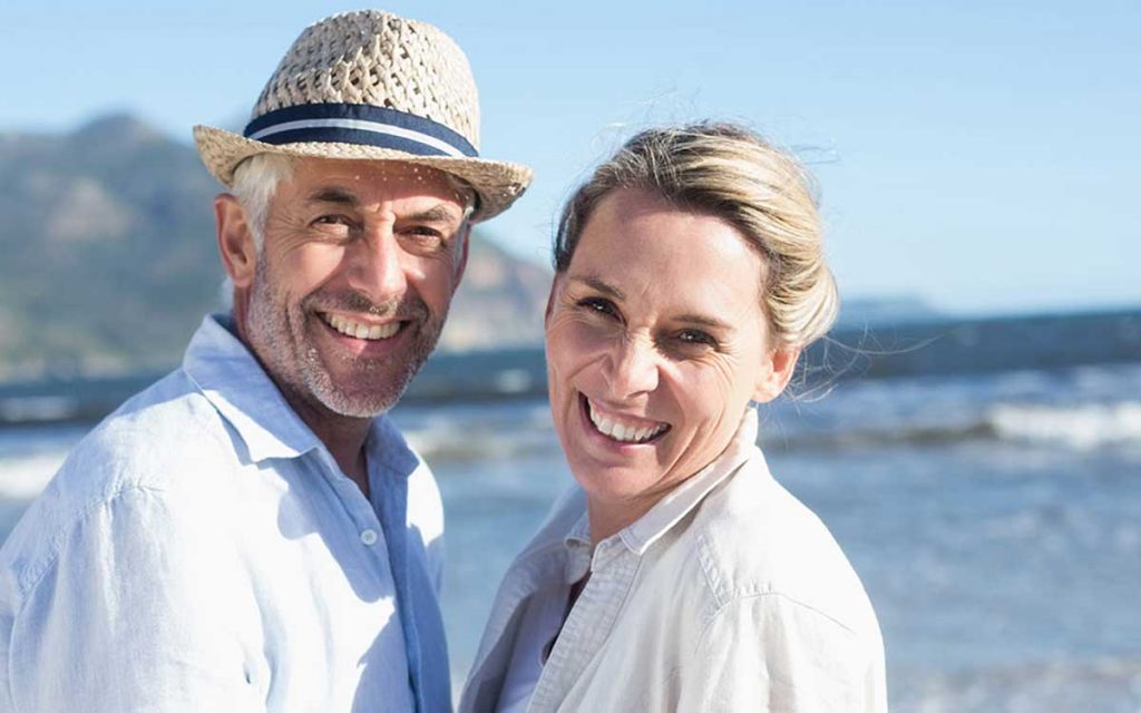 Happy couple avoiding hearing loss by be proactive.