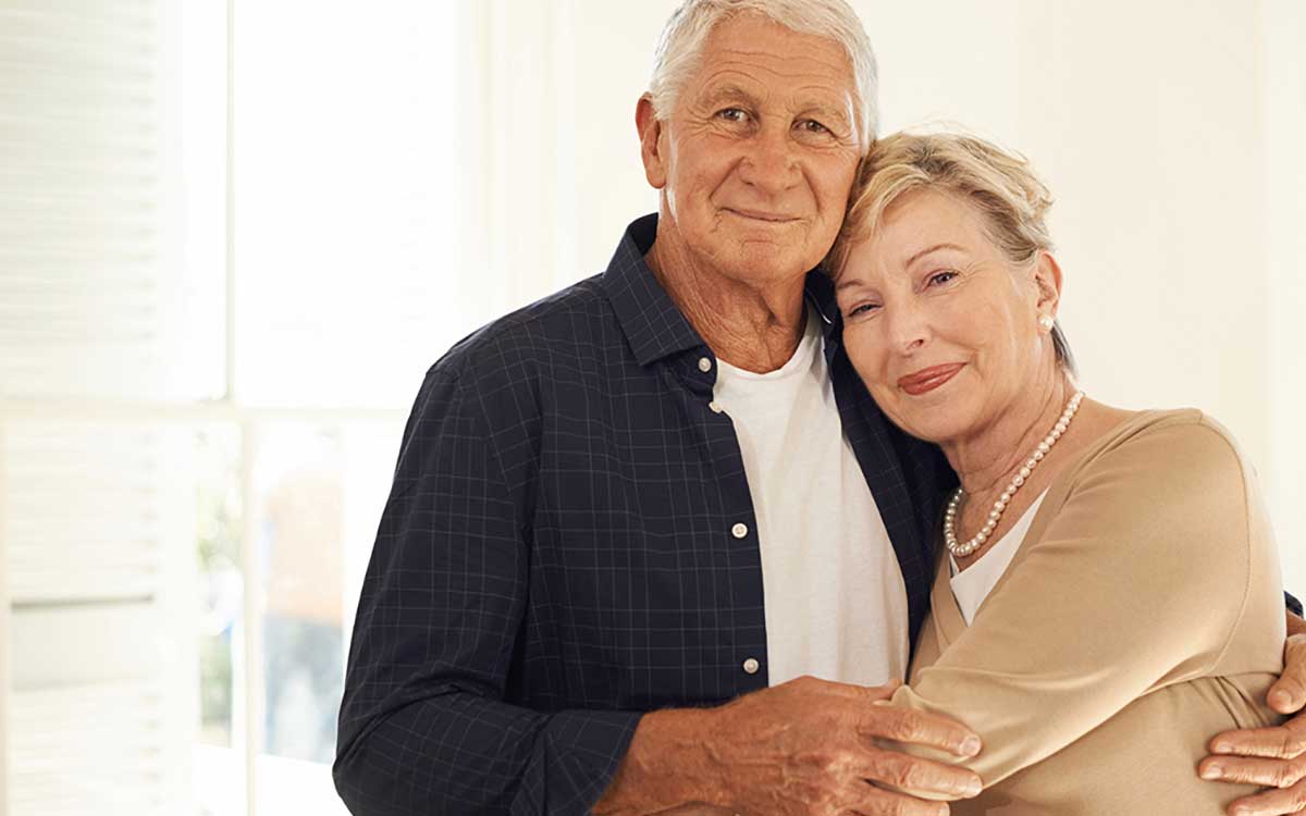 Happy couple with hearing aids