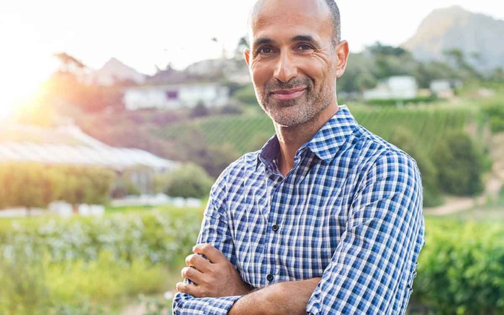 Youthful middle aged man becasue of hearing aids.