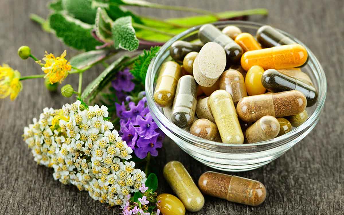 Vitamins on a table which may help hearing loss.