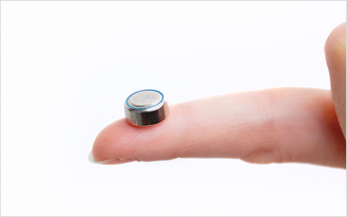 Button battery for hearing aids. Key to making them last.