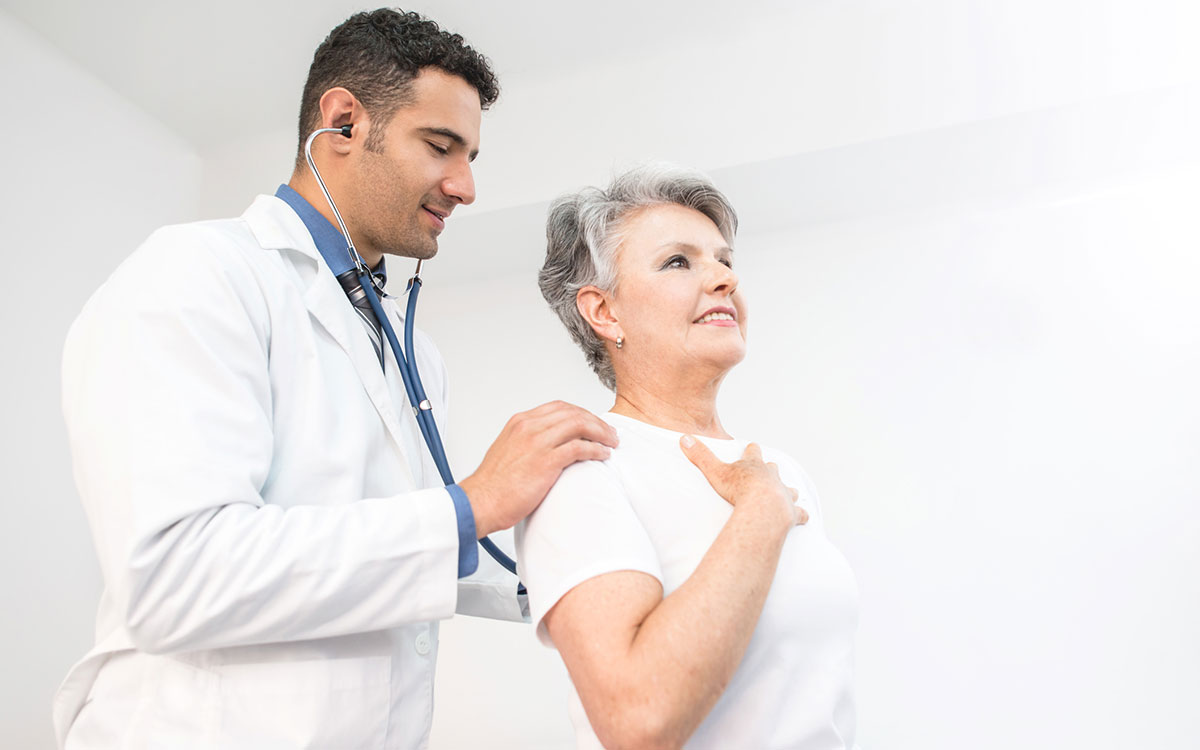 Woman getting her heart checked suffering from hearing loss.