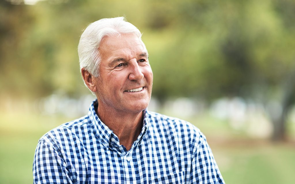 Doctor who's happy because of hearing implant.