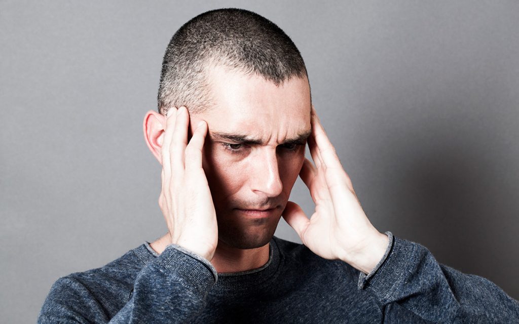 Tinnitus sufferer ignoring symptoms of hearing loss.