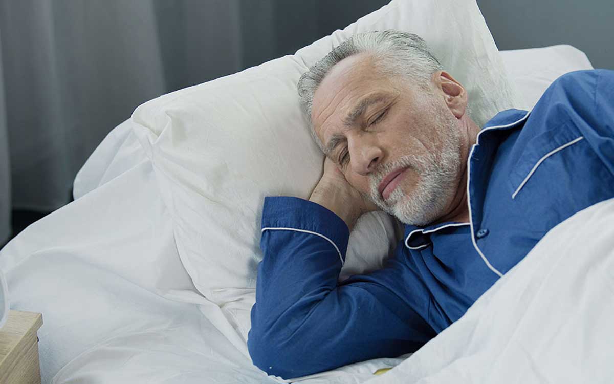 Man sleeping well even though he has Tinnitus.