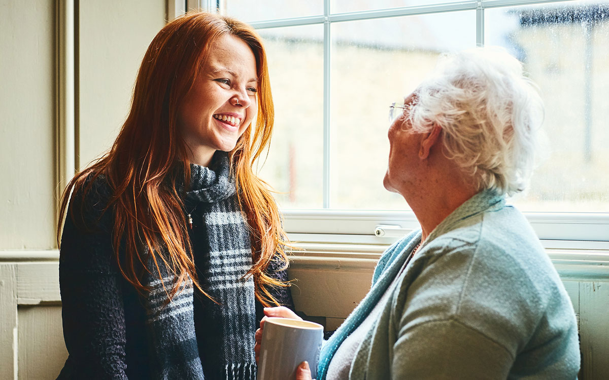 Woman talking to her grandmother about hearing test.