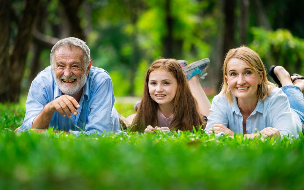 Happy family taking advantage of government programs to get hearing aids.