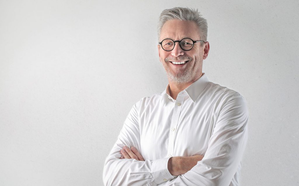 Happy man treated for hearing loss helped depression.