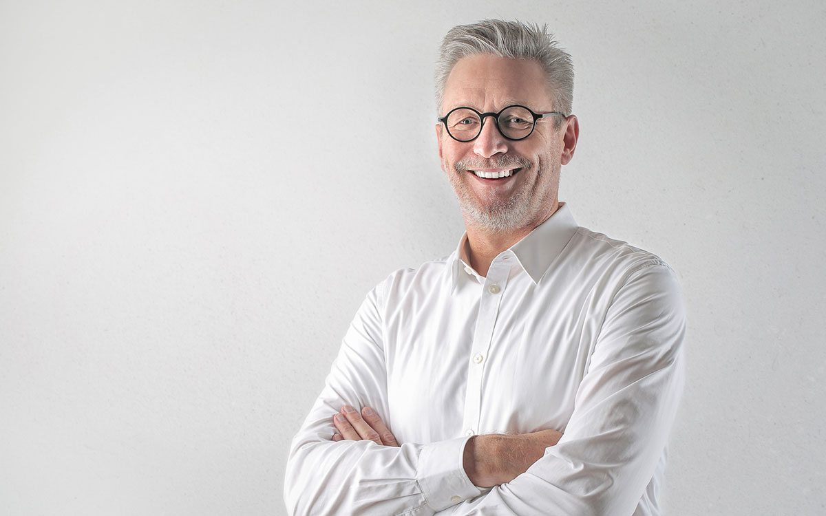 Happy man treated for hearing loss helped depression.