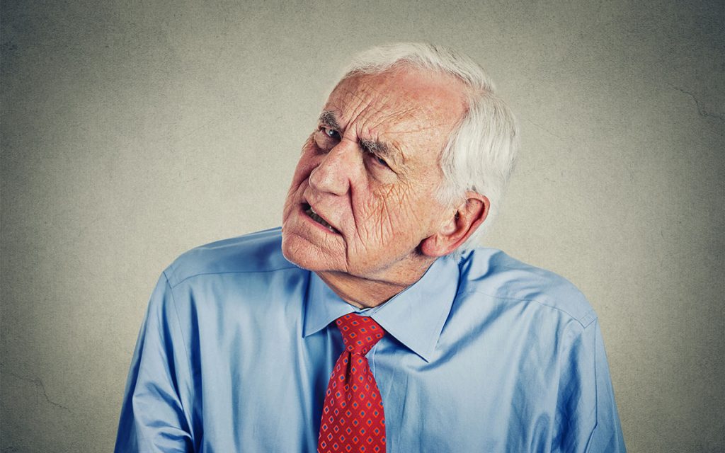 Man straining to hear as it occasionally goes out.