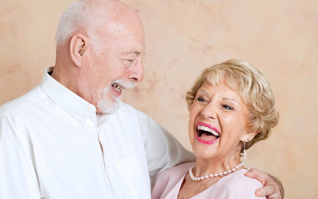 Happy senior couple happy their deafness is cured.