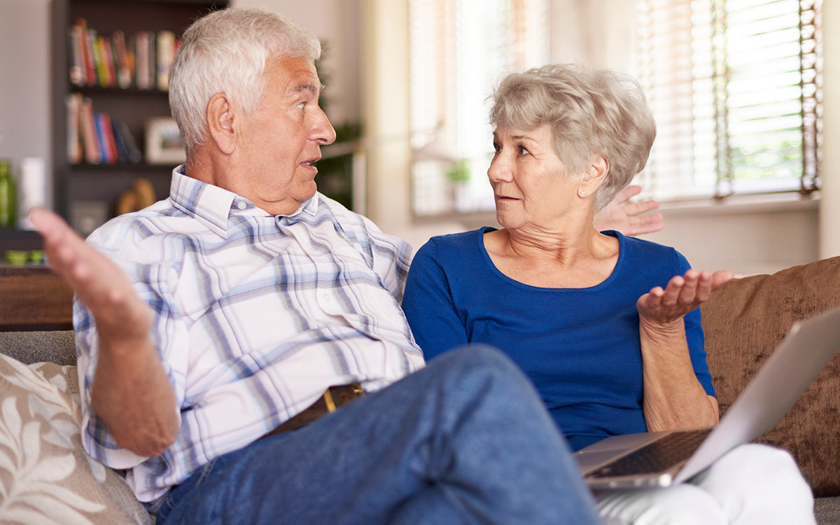 Couple looking very surprised about hearing loss facts.