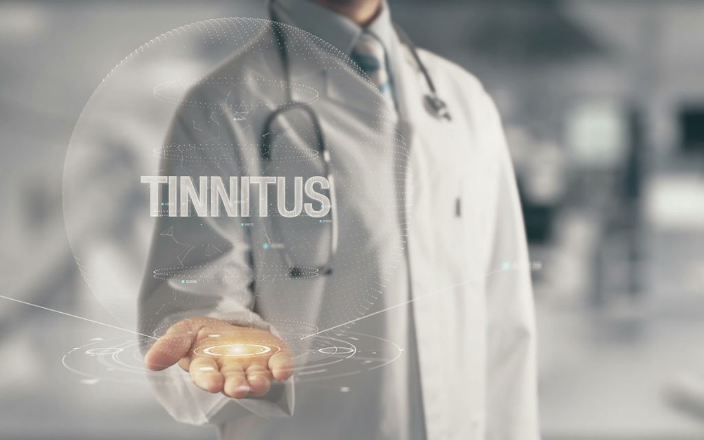 Doctor with the words Tinnitus in his hand.