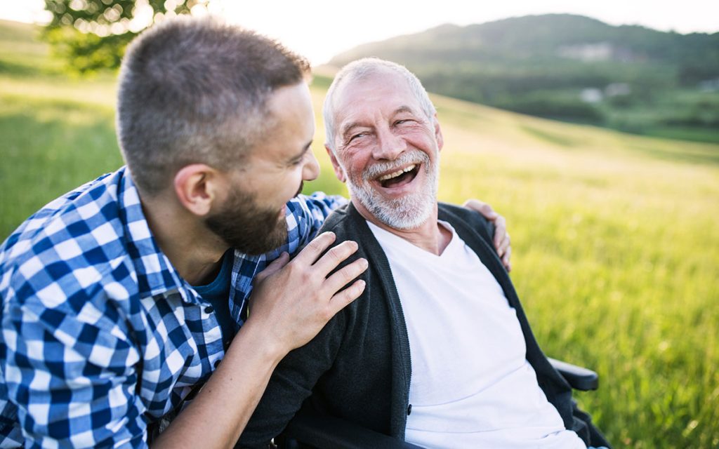 Happy man overcoming the stigma of hearing loss.