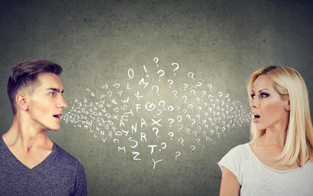 Man and woman talking to each other with letters coming out of their mouths.
