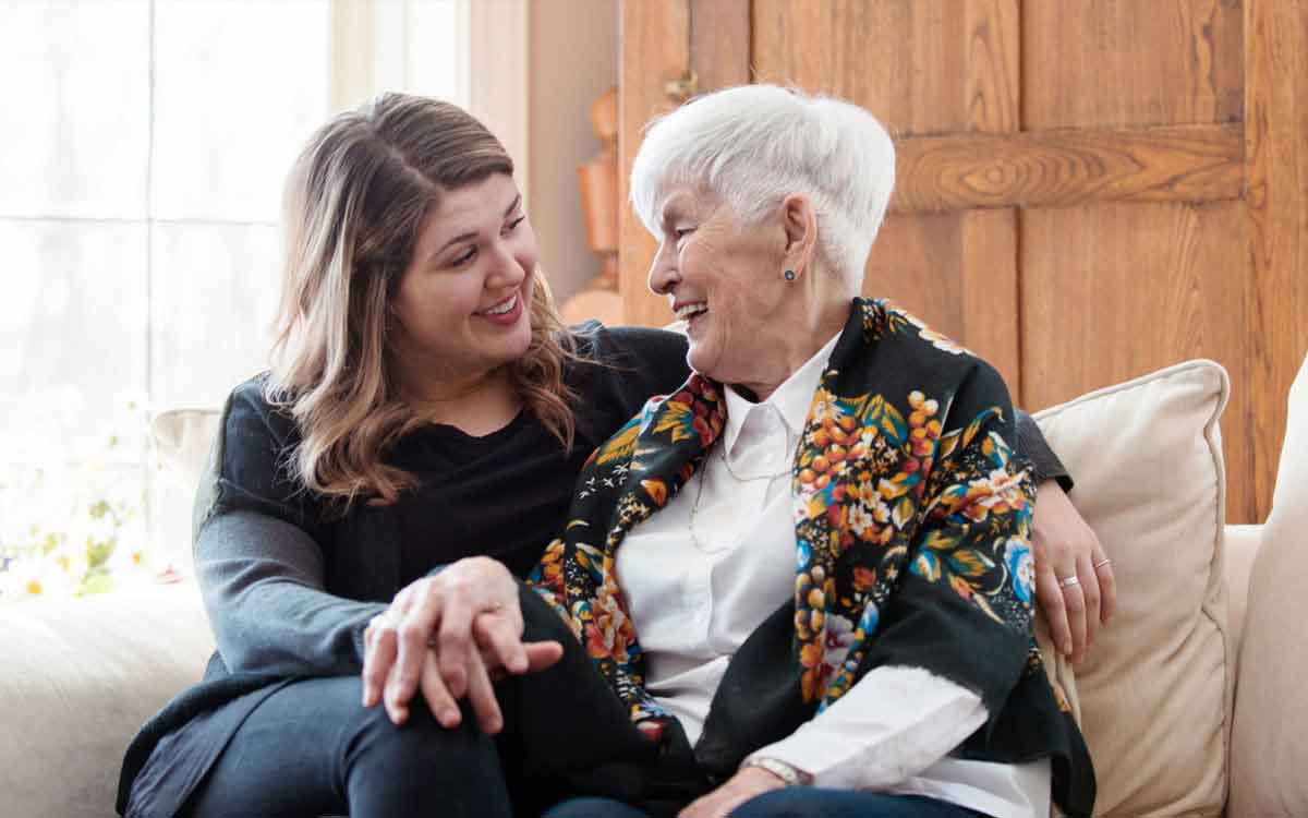 Woman and daughter talking about hearing aids.