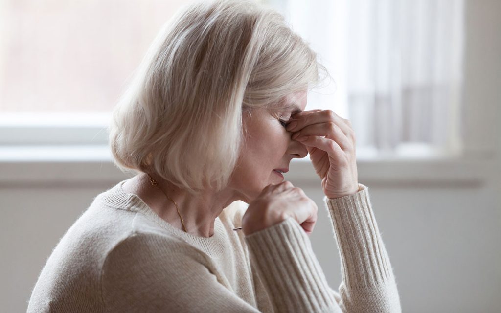 Tired woman suffering from fatigue.