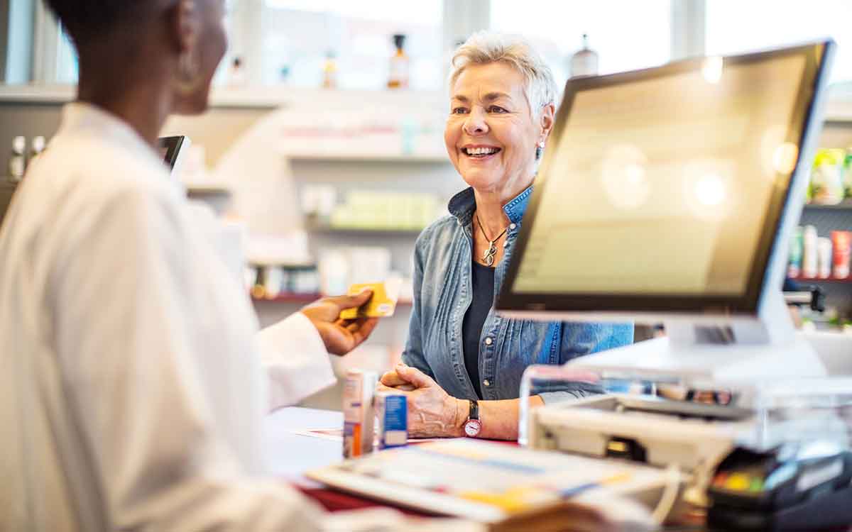 Woman purchasing over the counter hearing aids.