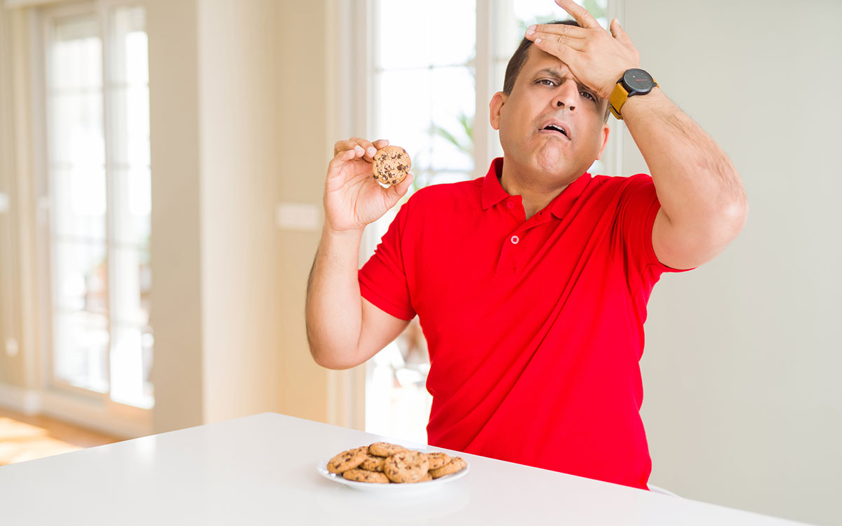 Man eating foods that make his Tinnitus worse.