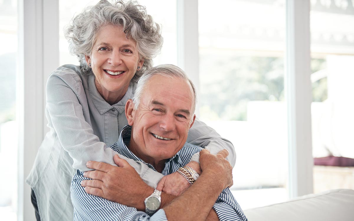 Happy seniors satisfied with their hearing aids.
