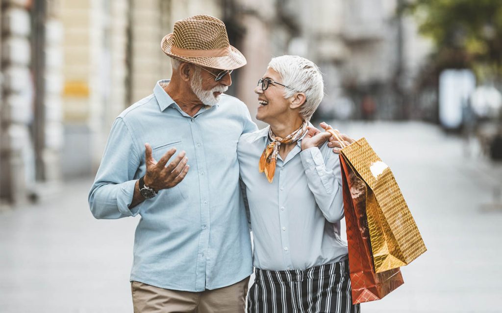 Senior couple shopping for over the counter hearing aids.