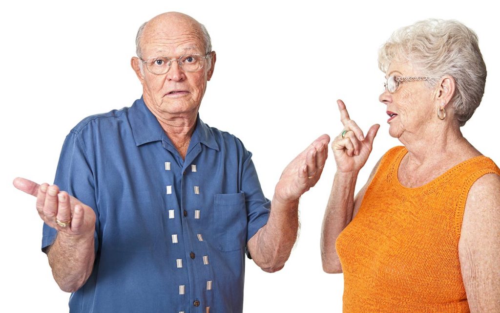 A senior couple having a discussion about hearing loss.