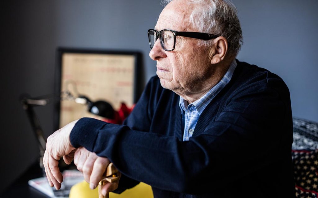 Close-up portrait of a senior man sad because of Tinnitus.
