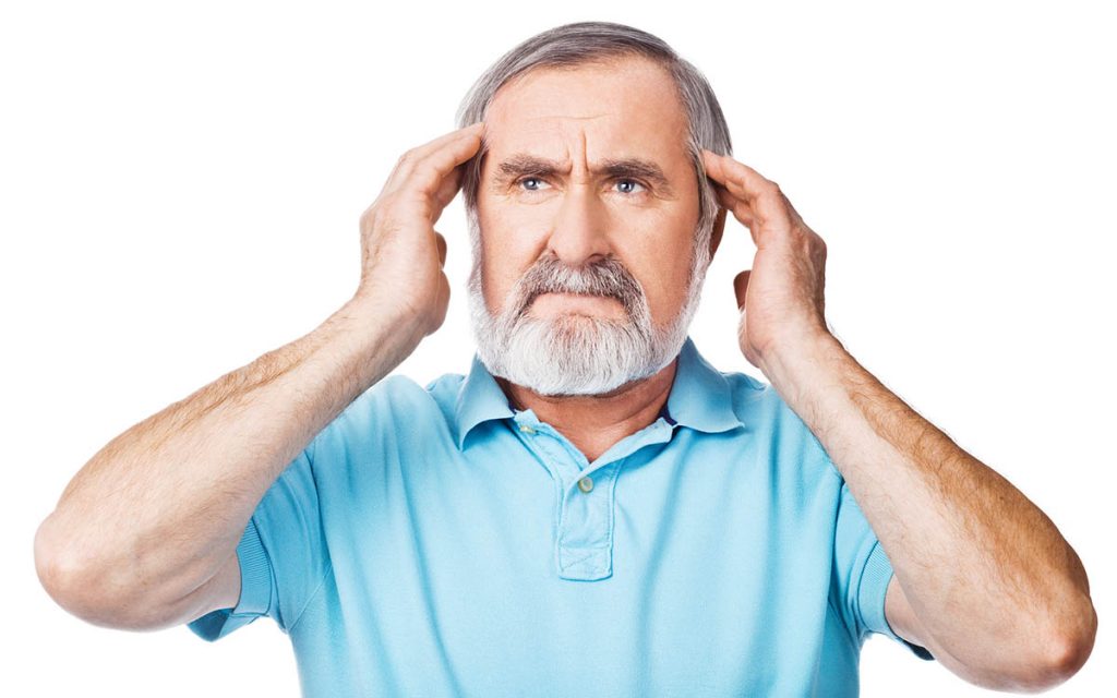 Man holds his ears because he hears a whooshing sound in his ear.