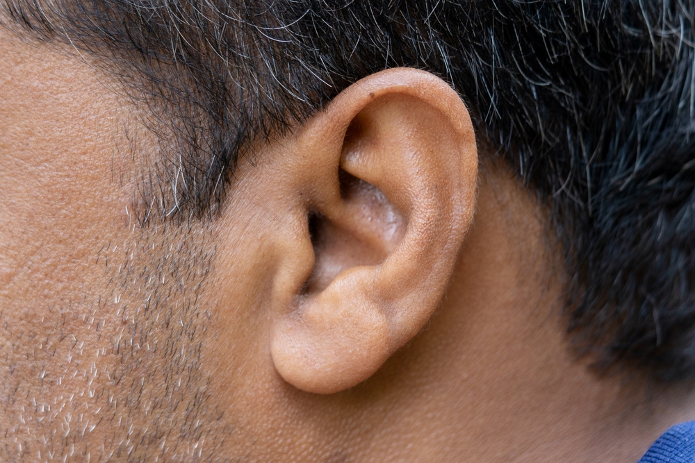 close-up image of man's ear.