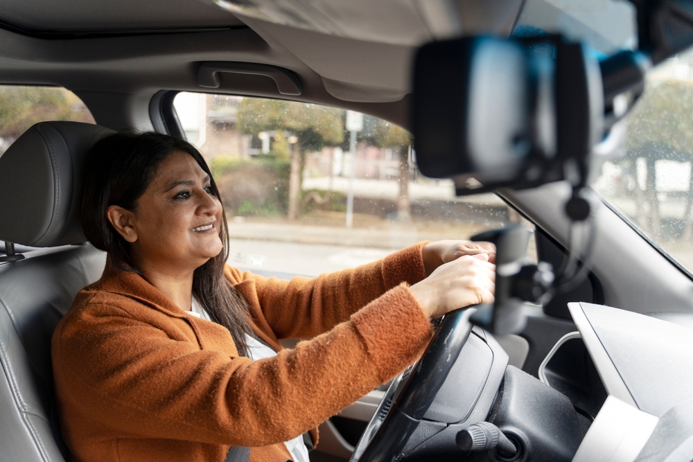 woman driving in car.