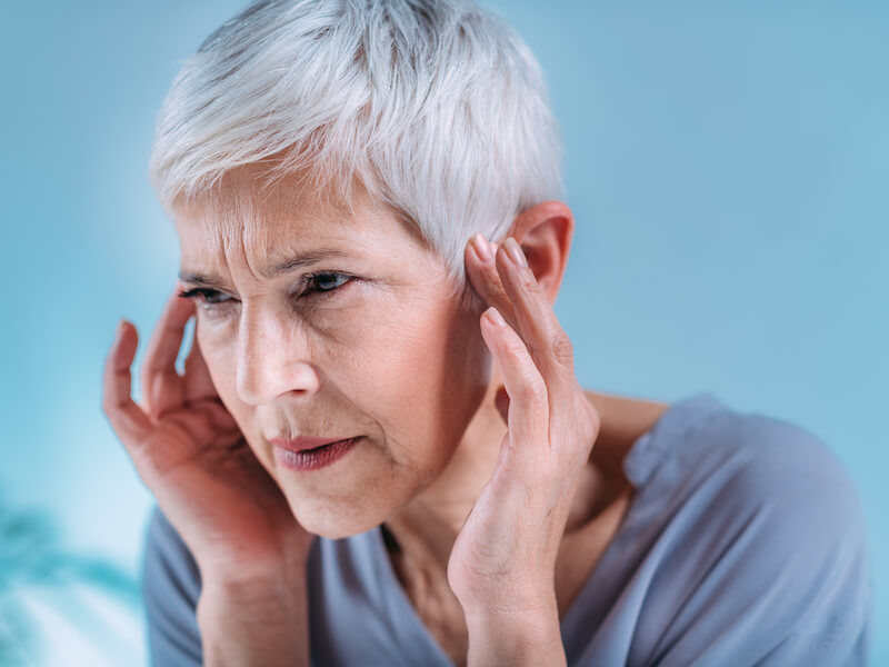 Woman with ringing in her ears.