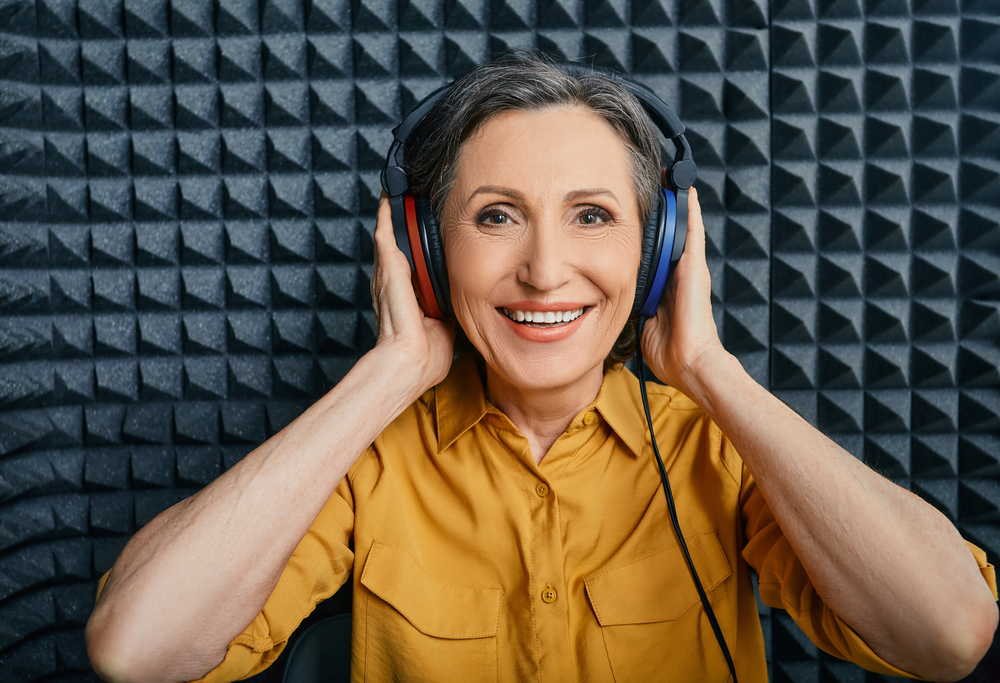 woman wearing audiometry headphones while in a hearing test.