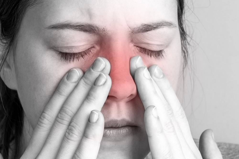 woman with sinus pressure pain.