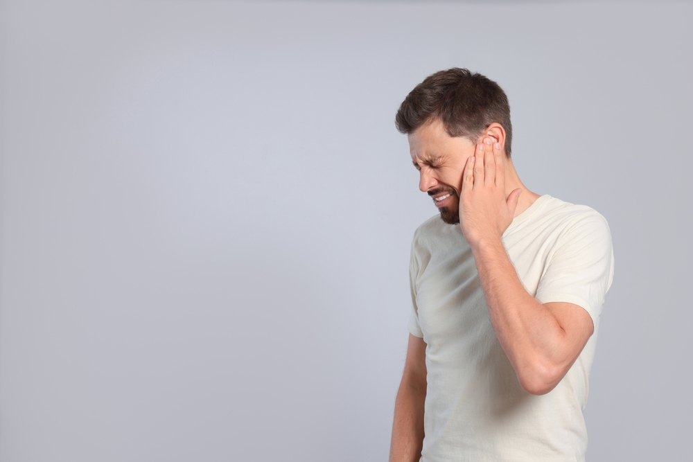 Person experiencing ear pain